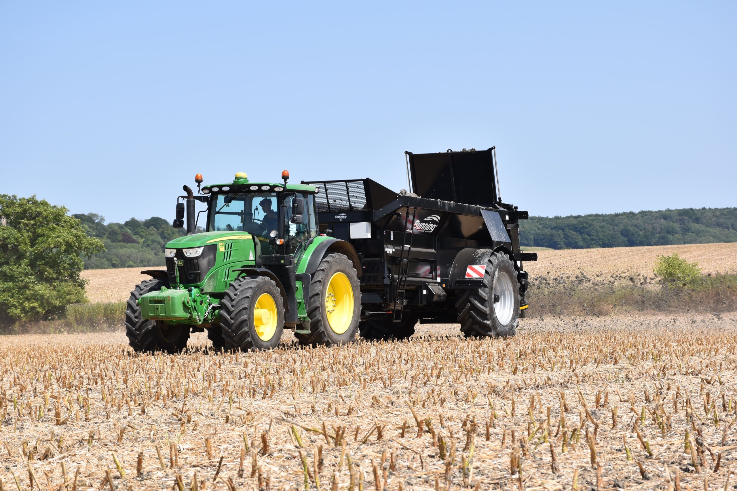 Paper sludge spreading with Tractor and Bunning spreader